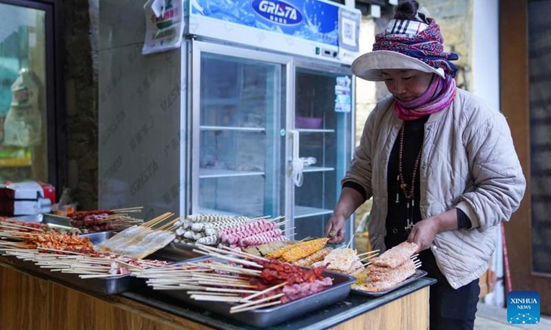 A staff member prepares food at a homestay at Yading scenic spot in Daocheng County of Tibetan Autonomous Prefecture of Garze, southwest China's Sichuan Province, Oct. 31, 2024. (Photo: Xinhua)