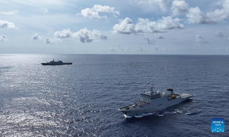 This video screenshot shows Chinese navy vessels Qijiguang (below) and Jinggangshan (above) sailing in formation in the Pacific Ocean, Oct. 24, 2024. (Photo: Xinhua)