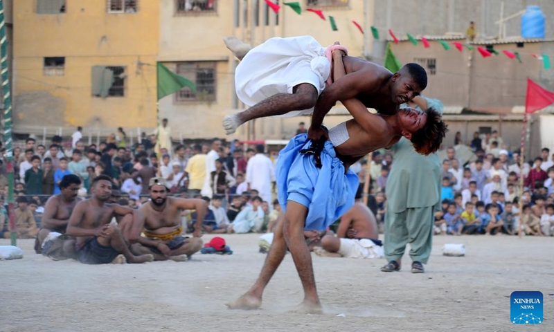 Wrestlers compete in a traditional wrestling match in southern Pakistani port city of Karachi on Nov. 1, 2024. (Photo: Xinhua)