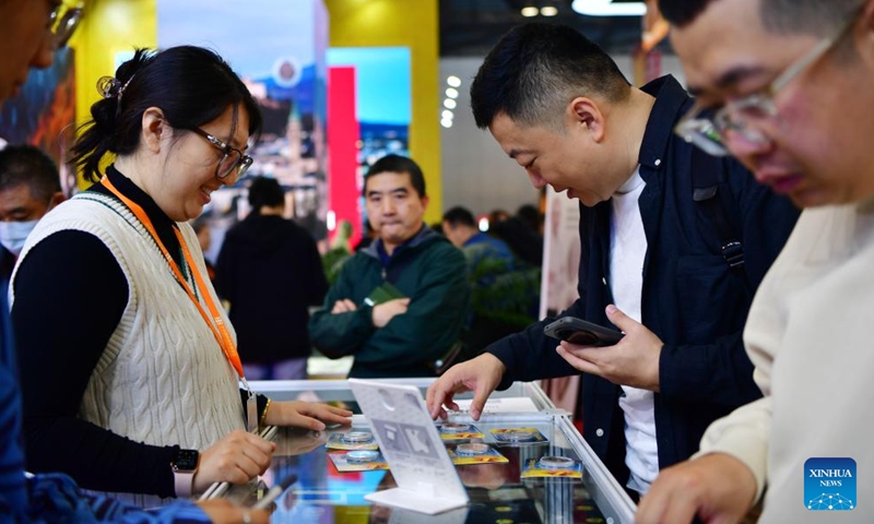 Visitors purchase foreign commemorative coins during the Beijing International Coin Exposition 2024 at the China National Convention Center in Beijing, capital of China, Nov. 1, 2024. (Photo: Xinhua)