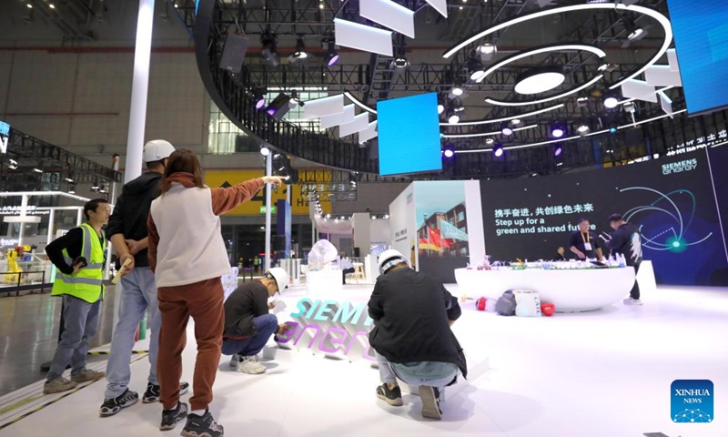 Workers set up exhibition booths for the upcoming 7th China International Import Expo (CIIE) at the National Exhibition and Convention Center (Shanghai), the main venue for the CIIE, in east China's Shanghai, Nov. 2, 2024. Preparations for the 7th CIIE, which is scheduled to take place in Shanghai from Nov. 5 to 10, have entered the final stage. (Photo: Xinhua)