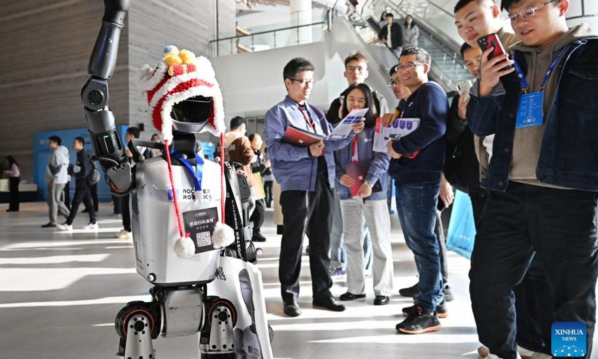 Participants visit the exhibition area of the 2024 China Automation Congress in Qingdao, east China's Shandong Province, Nov. 2, 2024. The 2024 China Automation Congress, which focuses on the deep integration of automation and artificial intelligence as well as explores the innovative development of new industries and technologies, would last from Nov. 1 to Nov. 3 here.  (Photo: Xinhua)