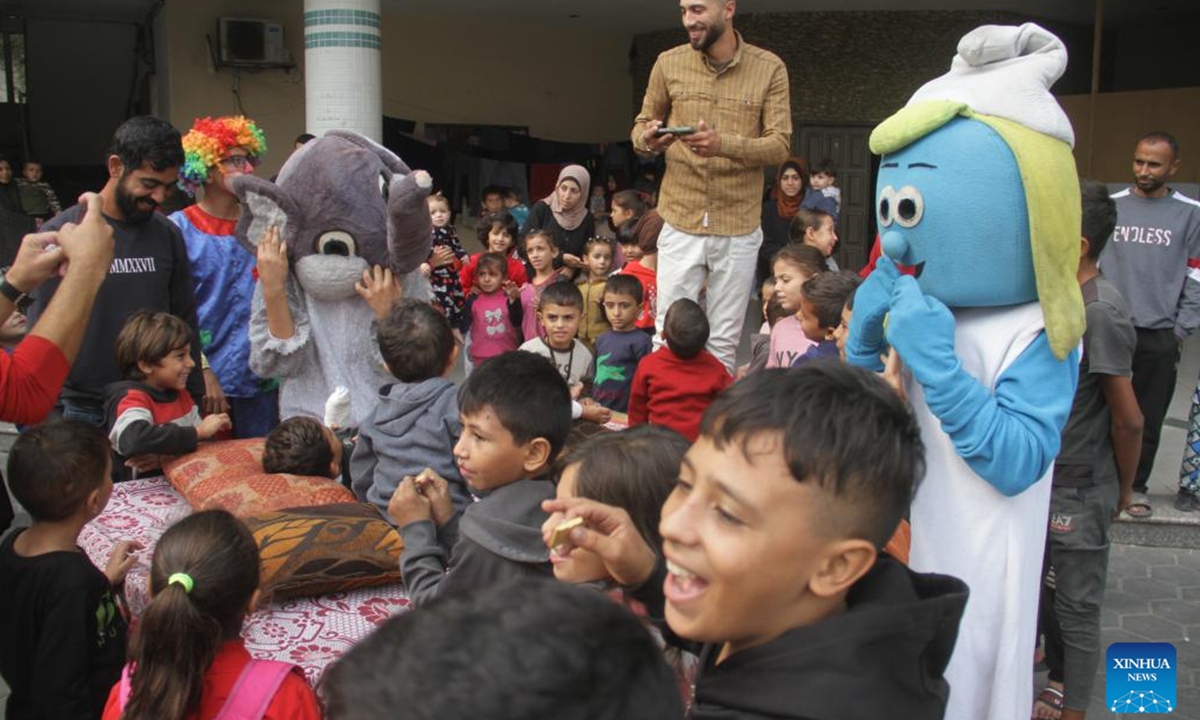 Palestinian children wait to receive polio vaccination at a UN-run school in Gaza City, on Nov. 2, 2024. A third phase of the polio vaccination campaign in the northern Gaza Strip is set to resume on Saturday after being postponed over escalating violence, a UN statement said on Friday. (Photo: Xinhua)