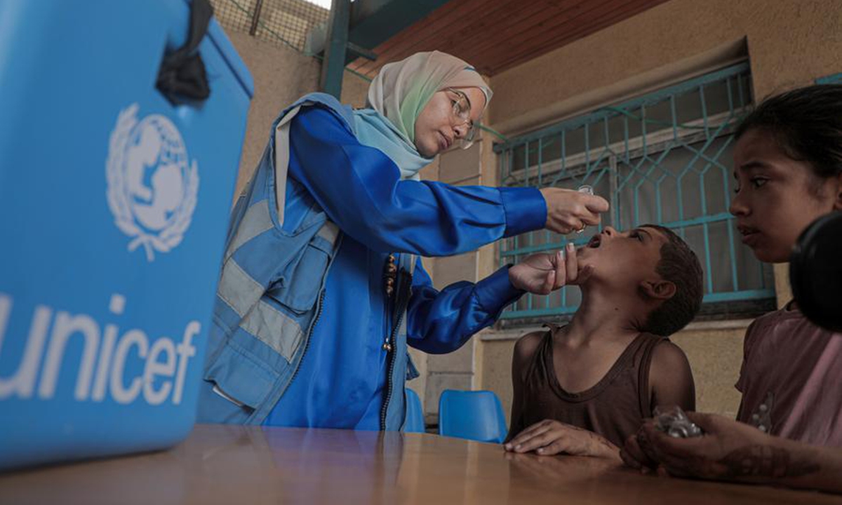 A child receives a dose of the polio vaccine at a UN-run clinic in Deir al-Balah city, central Gaza Strip, on Oct. 14, 2024. (Photo: Xinhua)