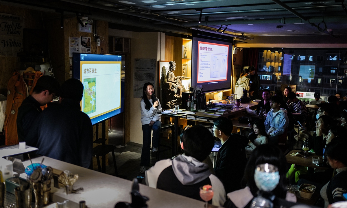 A lecture themed on urban exploration is held at the bar Universe Lounge in Beijing, on October 18, 2024. Photo: VCG