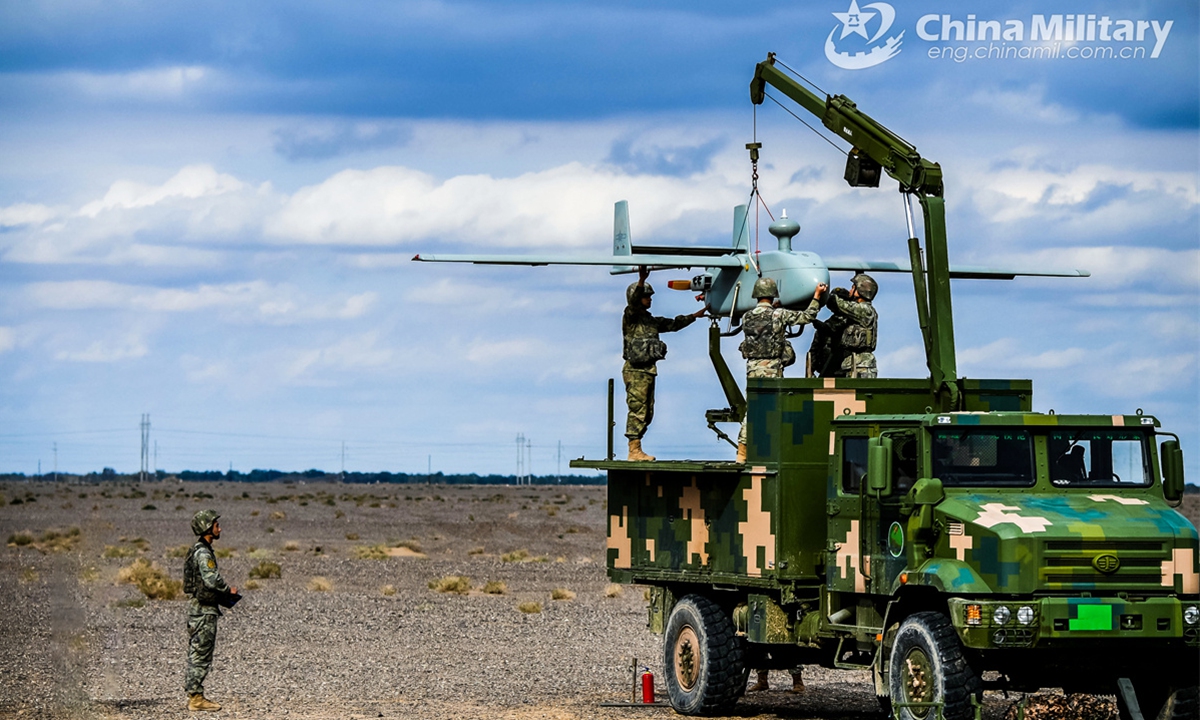 Soldiers assigned to a brigade under the Chinese PLA 74th Group Army work in team to prepare the Unmanned Aerial Vehicle (UAV) during an UAV flight training exercise on September 20, 2024.  (Photo: China Military Online )