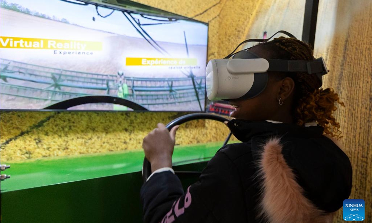 A girl experiences a virtual 360-degree grain farming ride at the 2024 Royal Agricultural Winter Fair in Toronto, Canada, on Nov. 1, 2024. Showcasing the best in agriculture, local food and more, the annual ten-day fair kicked off here on Friday.  (Photo: Xinhua)