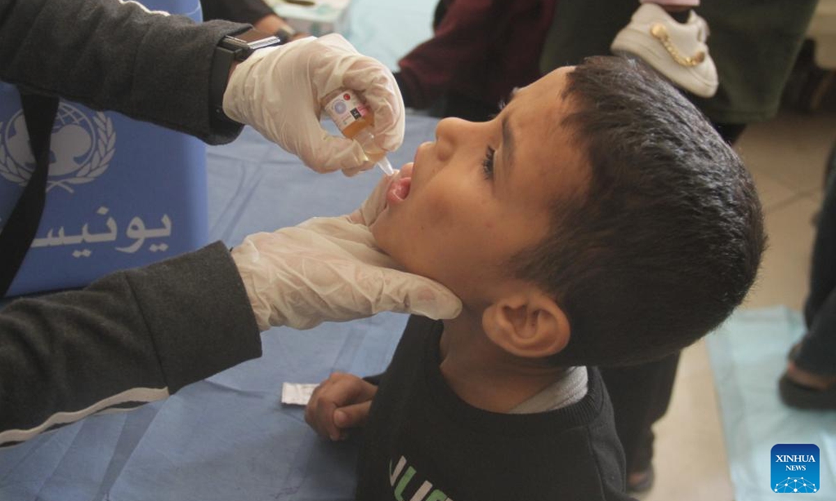 A Palestinian child receives a dose of polio vaccine at a UN-run school in Gaza City, on Nov. 2, 2024. A third phase of the polio vaccination campaign in the northern Gaza Strip is set to resume on Saturday after being postponed over escalating violence, a UN statement said on Friday. (Photo: Xinhua)