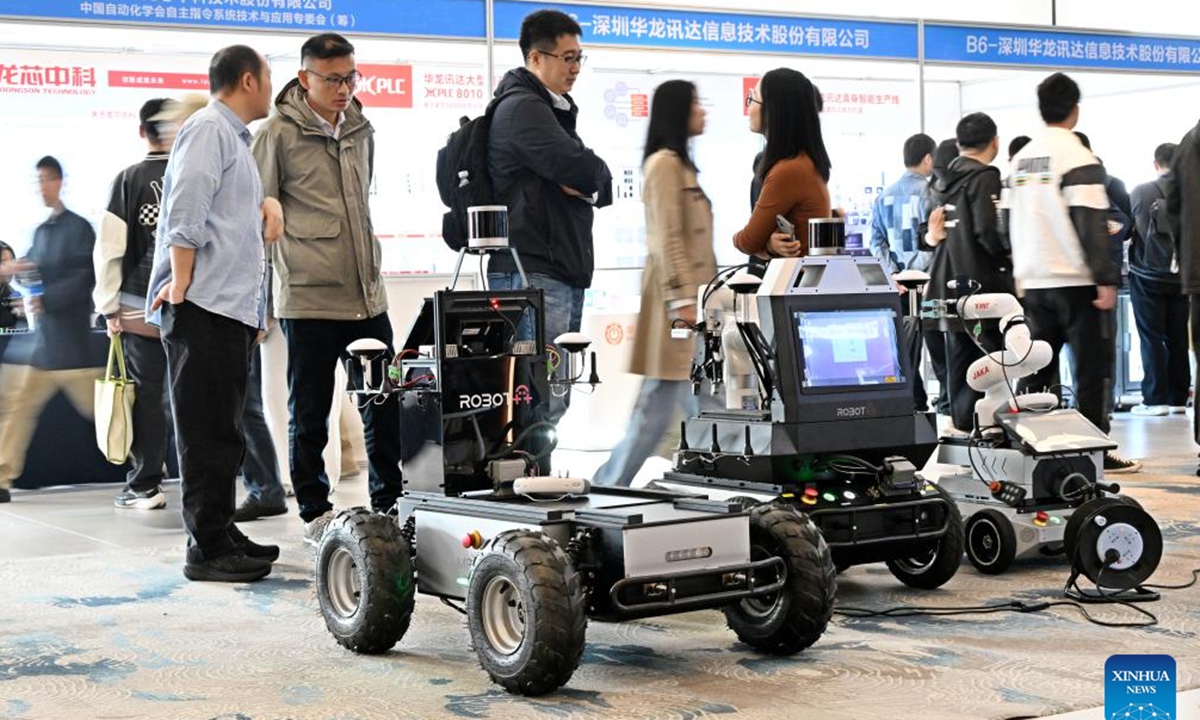 Participants visit the exhibition area of the 2024 China Automation Congress in Qingdao, east China's Shandong Province, Nov. 2, 2024. The 2024 China Automation Congress, which focuses on the deep integration of automation and artificial intelligence as well as explores the innovative development of new industries and technologies, would last from Nov. 1 to Nov. 3 here.  (Photo: Xinhua)