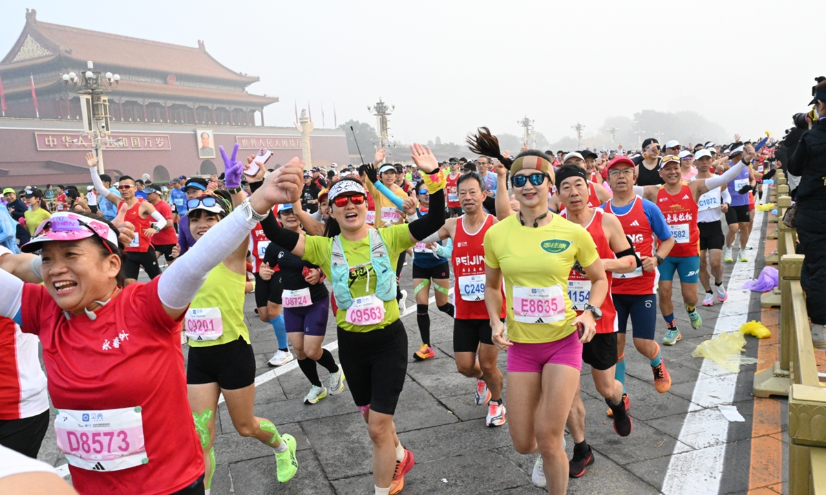 Participants run past the Tian'anmen Square during the Beijing Marathon in Beijing, on November 3, 2024. Photo: Chen Tao/GT