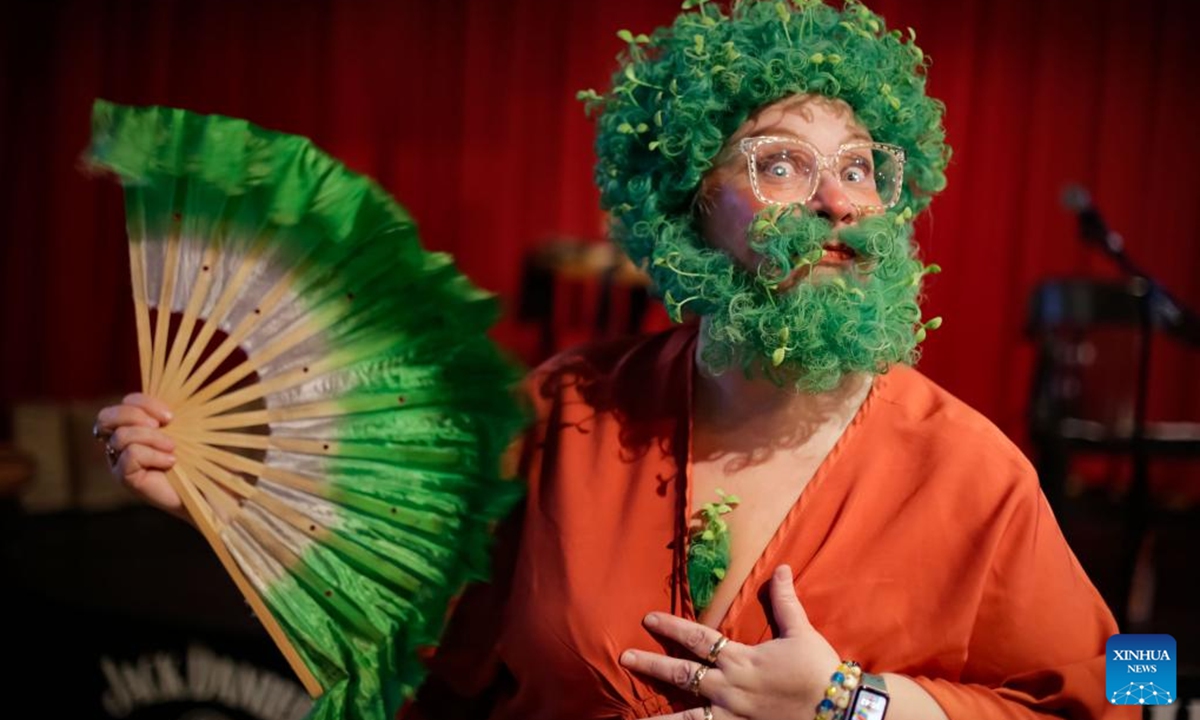 A female contestant wearing artificial hair and facial hair competes in the Whiskerina category during the annual Facial Hair Competition held in Vancouver, British Columbia, Canada, Nov. 2, 2024.  (Photo: Xinhua)