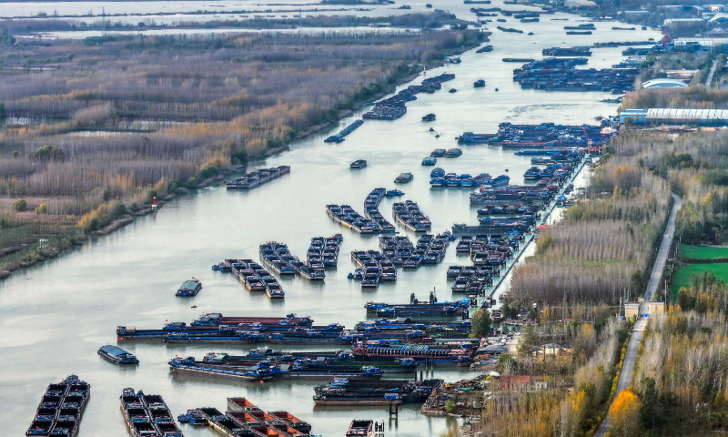 Cargo ships arrive and leave from a wharf at the Weishan section of the Beijing-Hangzhou Grand Canal in Jining, East China's Shandong Province, on November 17, 2024. With a history of more than 2,500 years, the Grand Canal, connecting Beijing and Hangzhou in East China's Zhejiang Province, served as a significant transportation artery in ancient China. Photo: VCG