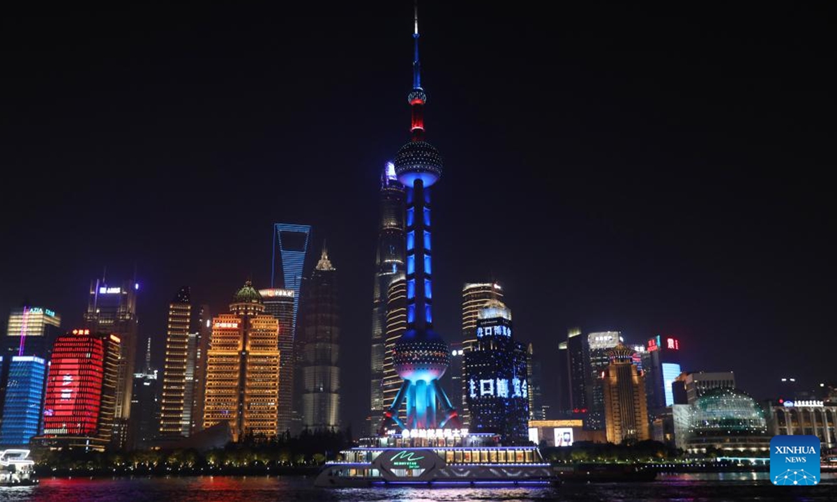 Landmarks are lit up to welcome the 7th China International Import Expo (CIIE) in Lujiazui area in east China's Shanghai, Nov. 3, 2024. The 7th CIIE will be held in Shanghai from Nov. 5 to 10. (Photo: Xinhua)