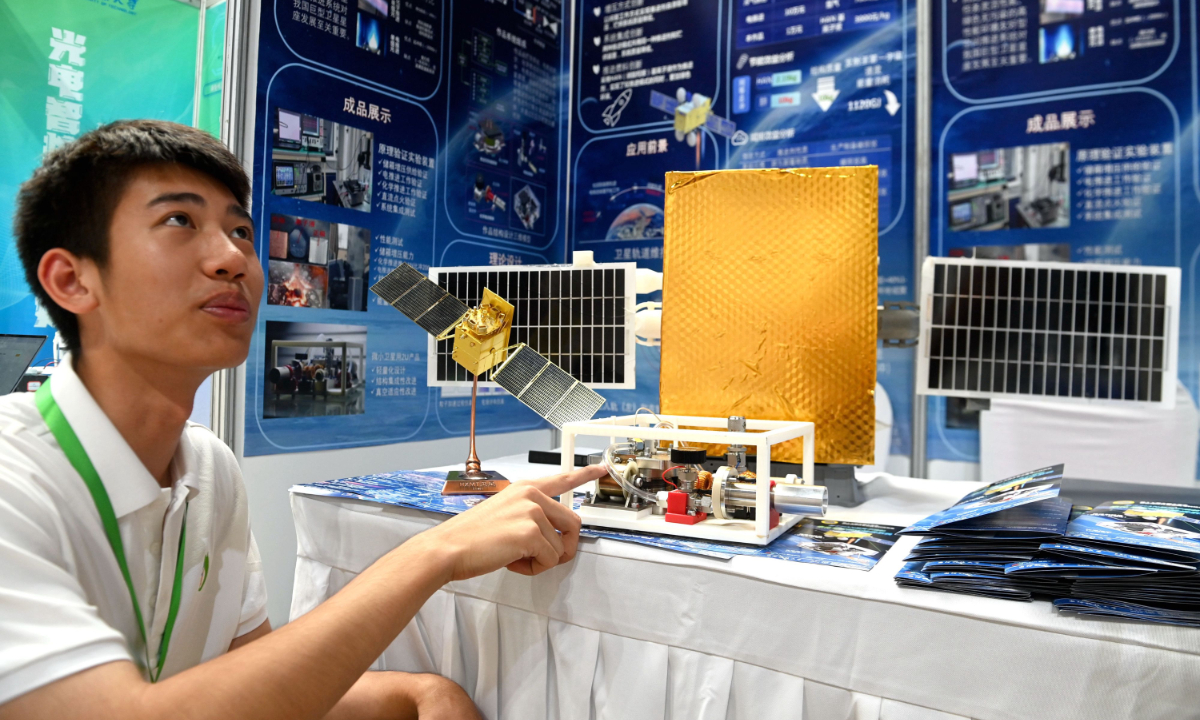 A contestant from East China's Shandong Province showcases his entry when attending the 17th National University Student Social Practice and Science Contest on Energy Saving and Emission Reduction on August 5, 2024. Photo: IC