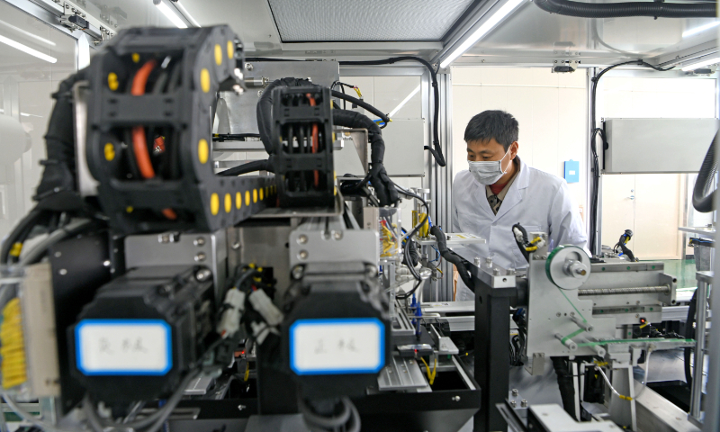 A worker produces aqueous sodium-ion batteries at a laboratory in Huainan, East China's Anhui Province, on December 2, 2024. The battery has achieved scale production. Aqueous sodium-ion batteries are used widely in areas such as large-scale energy storage, low-speed electric vehicles and emergency backup power sources. Photo: VCG