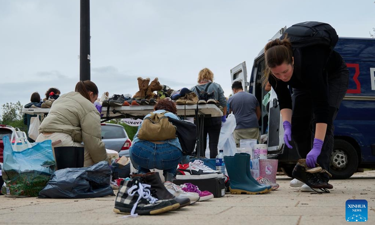 Volunteers distribute relief supplies in Valencia, Spain, Nov. 3, 2024.

The flash floods that swept through the Spanish regions of Valencia, Castilla-La Mancha, and Andalusia last week have claimed 217 lives as of Sunday, with many still unaccounted for. (Photo: Xinhua)