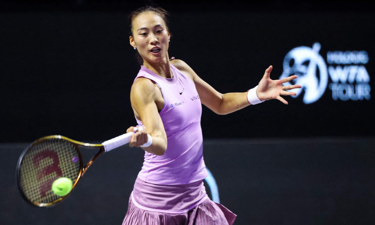 China's Zheng Qinwen hits a return against Czech Republic's Barbora Krejcikova during their women's singles semifinal match at the WTA Finals in Riyadh on November 8, 2024. Photo: VCG