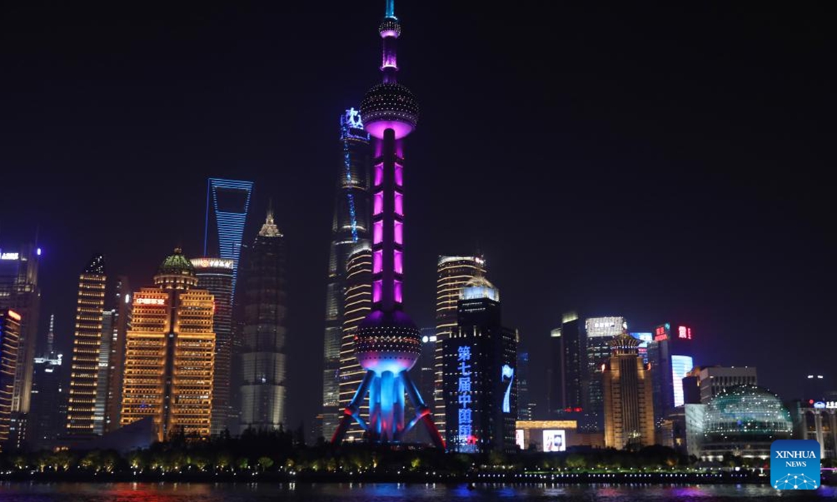 Landmarks are lit up to welcome the 7th China International Import Expo (CIIE) in Lujiazui area in east China's Shanghai, Nov. 3, 2024. The 7th CIIE will be held in Shanghai from Nov. 5 to 10. (Photo: Xinhua)