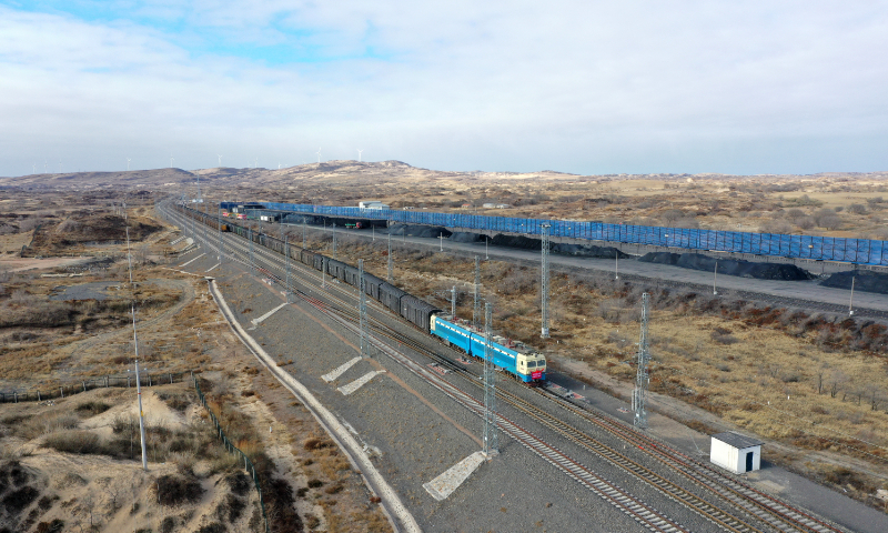 A freight train runs on the Jining-Tongliao railway in Chifeng, North China's Inner Mongolia Autonomous Region on November 21, 2024, marking the first day of fully electrified operations on the railway. The Jining-Tongliao railway is an important trunk line connecting the northeastern, northern and northwestern parts of China. Photo: cnsphoto