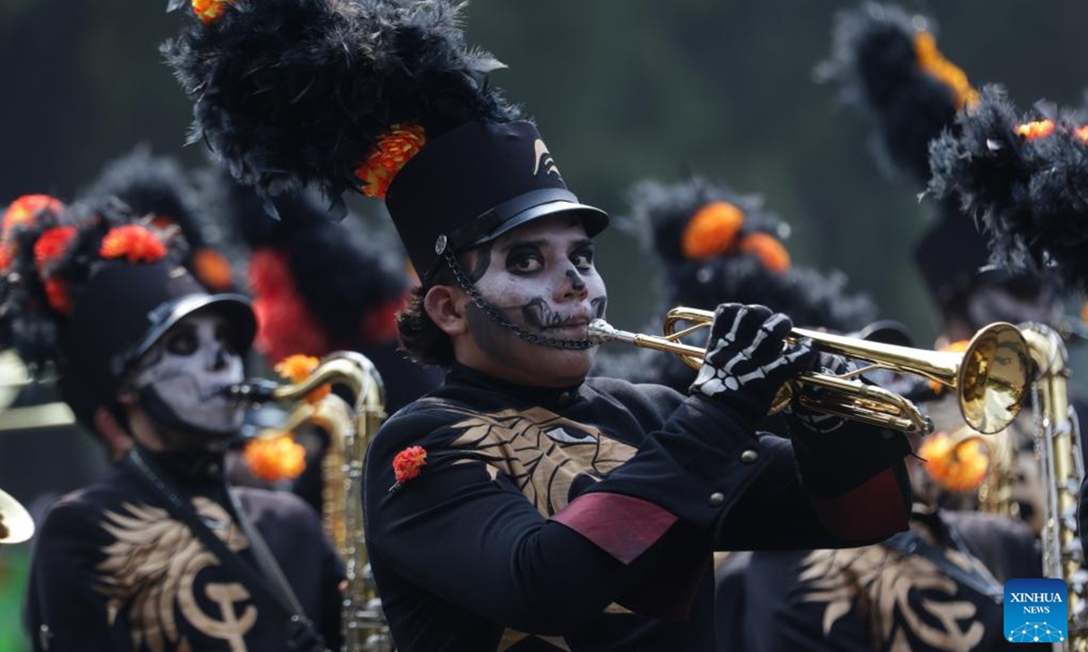 People in costumes and facial makeup participate in the Day of the Dead Parade in downtown Mexico City, capital of Mexico, on Nov. 2, 2024.  (Photo: Xinhua)