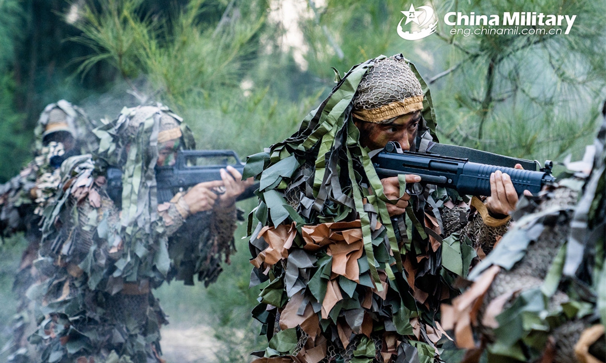 Soldiers assigned to a reconnaissance detachment of an army brigade under the Chinese PLA Eastern Theater Command cover each other in firing position while marching in the jungle during a reconnaissance and infiltration training exercise on August 29, 2024. (Photo: China Military Online)