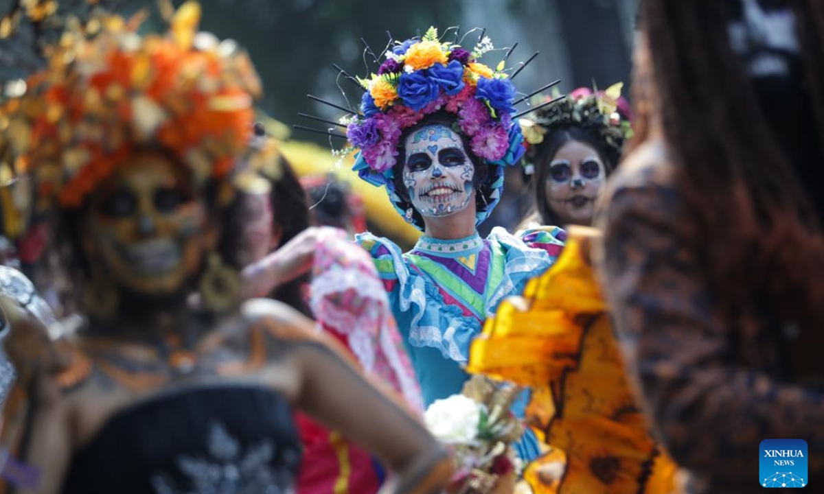 People in costumes and facial makeup participate in the Day of the Dead Parade in downtown Mexico City, capital of Mexico, on Nov. 2, 2024. (Photo: Xinhua)