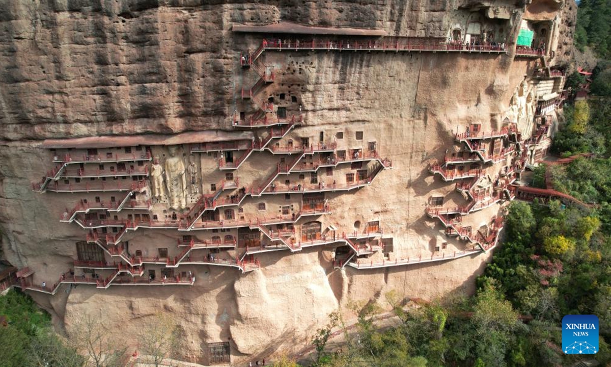 An aerial drone photo taken on Nov. 2, 2024 shows a view of the Maiji Mountain Grottoes in Maiji District of Tianshui City, northwest China's Gansu Province. The Maiji Mountain Grottoes is one of the four most famous grottoes in China.   (Photo: Xinhua)