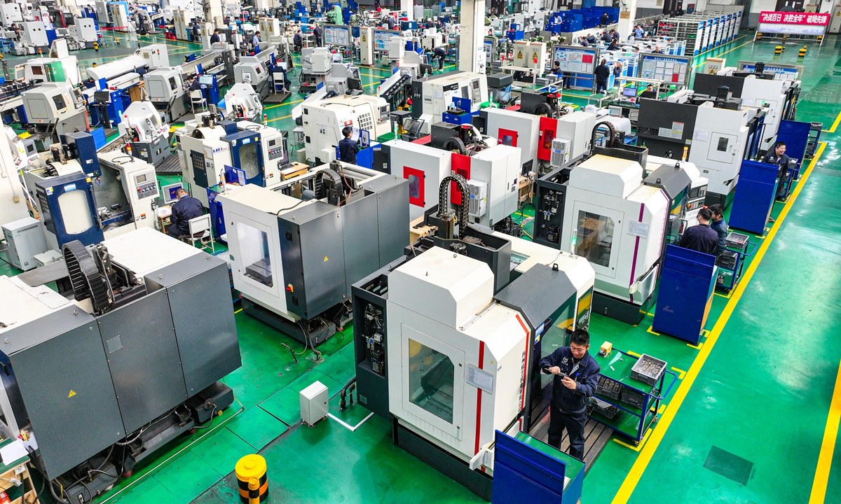 Workers at an aerospace electronics company in Shenyang, Northeast China's Liaoning Province, are busy fulfilling orders as they push to meet fourth-quarter production targets, on November 5, 2024. According to the General Administration of Customs, China's high-tech product exports in the first nine months of 2024 reached 4.55 trillion yuan ($640 billion), up 6.1% year-on-year. Photo: VCG