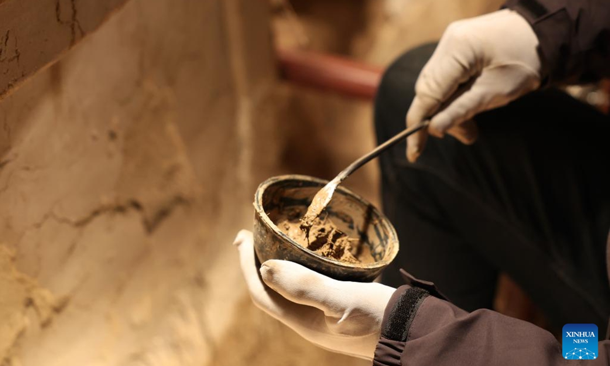 Mu Changyou, a cultural relics restorer of Maiji Mountain Grottoes art institute, carries out protection and restoration work at a cave of the Maiji Mountain Grottoes in Maiji District of Tianshui City, northwest China's Gansu Province on Nov. 2, 2024.   (Photo: Xinhua)