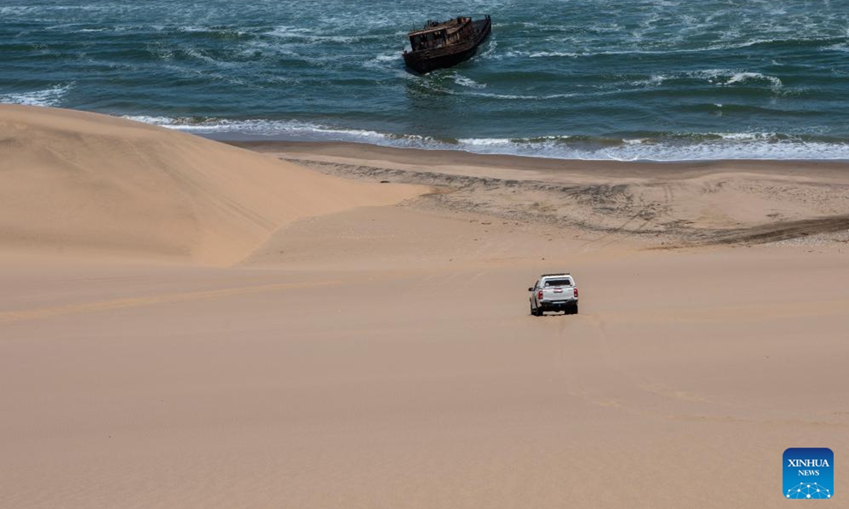 A car runs on the Meob Bay at the Namib-Naukluft National Park in Namibia, Nov. 2, 2024. (Photo: Xinhua)