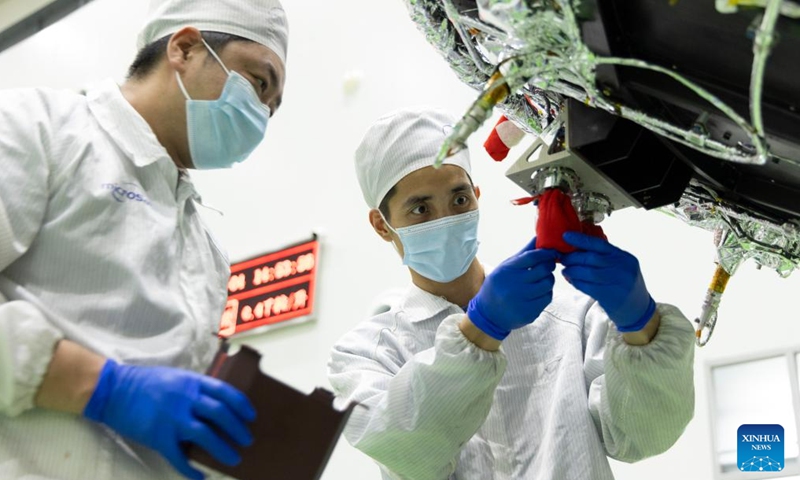 Technicians check the Solar wind Magnetosphere Ionosphere Link Explorer (SMILE) at a workshop of the Innovation Academy for Microsatellites of Chinese Academy of Sciences (CAS) in Shanghai, east China, Nov. 4, 2024. (Photo: Xinhua)