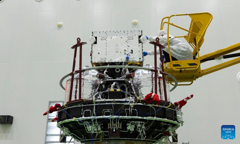 A technician checks the Solar wind Magnetosphere Ionosphere Link Explorer (SMILE) at a workshop of the Innovation Academy for Microsatellites of Chinese Academy of Sciences (CAS) in Shanghai, east China, Nov. 4, 2024. (Photo: Xinhua)