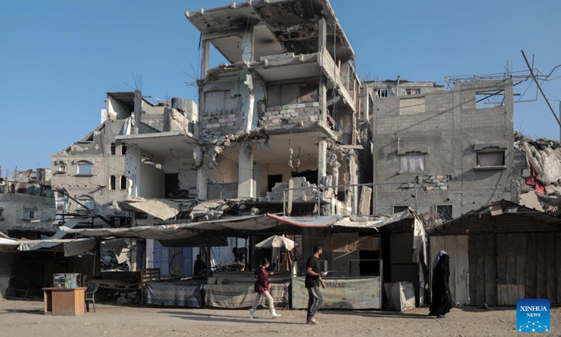 People are seen at an empty market in the southern Gaza Strip city of Khan Younis, on Nov. 5, 2024. (Photo: Xinhua)