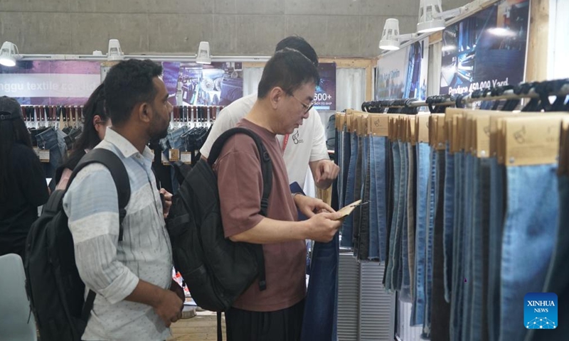 People visit the 17th edition of Bangladesh's largest denim exposition in Dhaka, Bangladesh, Nov. 4, 2024. The 17th edition of Bangladesh's largest denim exposition themed The Blue New World kicked off Monday in capital Dhaka. (Photo: Xinhua)