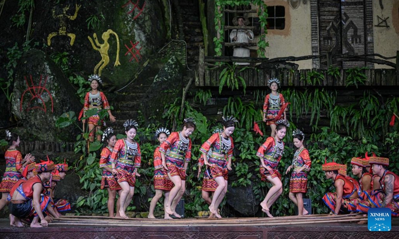 Actors perform at Binglanggu tourism area in Baoting Li and Miao Autonomous County, south China's Hainan Province, Nov. 4, 2024. (Photo: Xinhua)