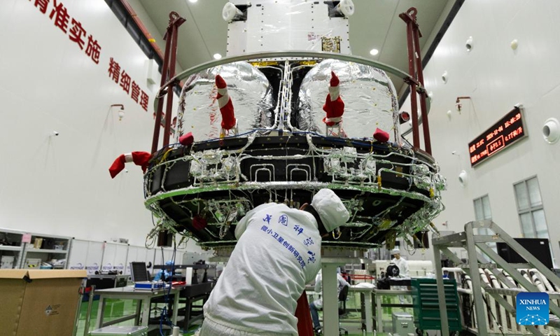 A technician checks the Solar wind Magnetosphere Ionosphere Link Explorer (SMILE) at a workshop of the Innovation Academy for Microsatellites of Chinese Academy of Sciences (CAS) in Shanghai, east China, Nov. 4, 2024. (Photo: Xinhua)