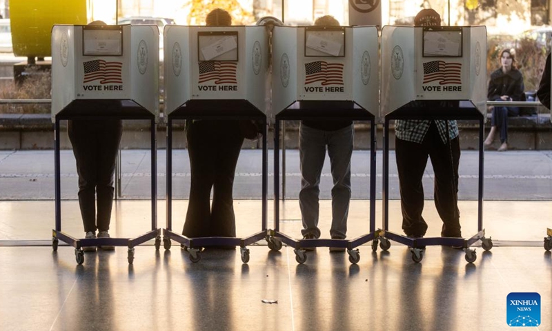 Voters fill in their ballots at a polling station during the 2024 U.S. presidential election at the Brooklyn Museum in New York, the United States, on Nov. 5, 2024. (Photo: Xinhua)