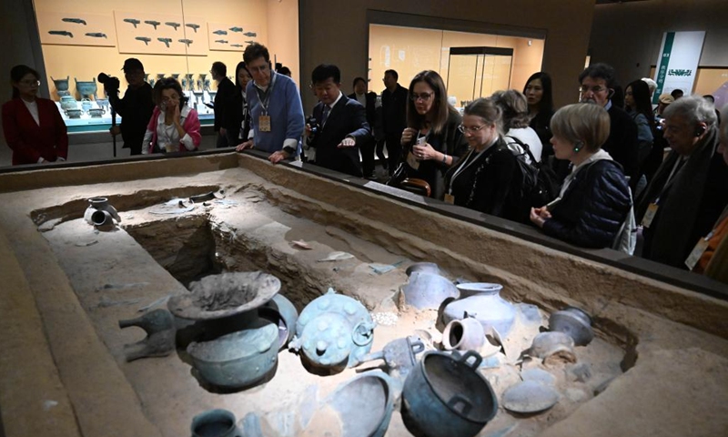 Foreign guests visit Yinxu Museum in Anyang, central China's Henan Province, Nov. 5, 2024. Over 40 foreign participants of the inaugural World Conference on Classics visited Henan to explore the openness and inclusiveness of Chinese civilization from Nov. 3 to 5. (Photo: Xinhua)