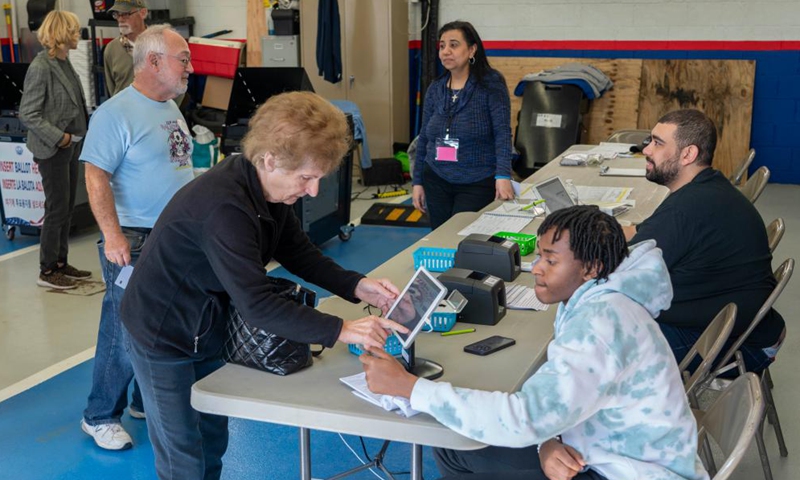 Voters line up to verify their identification at a polling station during the 2024 U.S. presidential election in Fort Lee, New Jersey, the United States, on Nov. 5, 2024. (Photo: Xinhua)