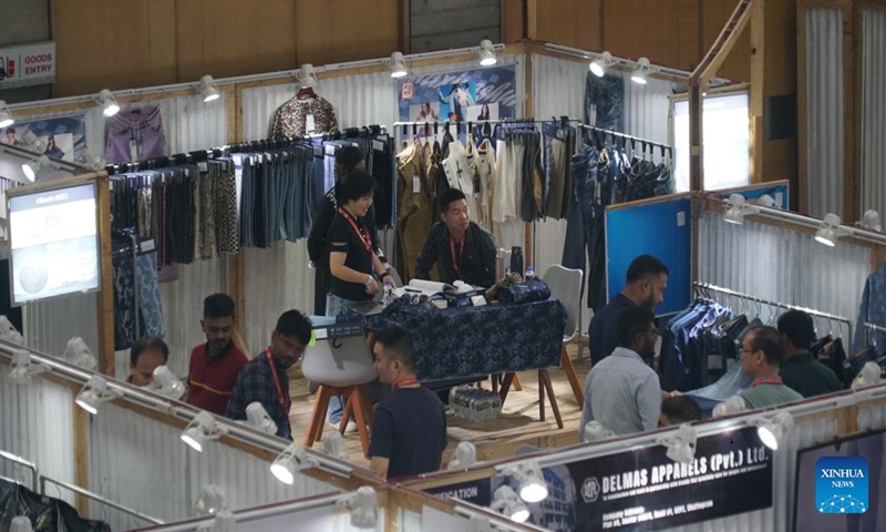 People visit the 17th edition of Bangladesh's largest denim exposition in Dhaka, Bangladesh, Nov. 4, 2024. The 17th edition of Bangladesh's largest denim exposition themed The Blue New World kicked off Monday in capital Dhaka. The two-day expo has attracted scores of participants from many countries, offering international fashion buyers a one-stop sourcing platform for all aspects of jeanswear at the Dhaka's International Convention City. (Photo: Xinhua)