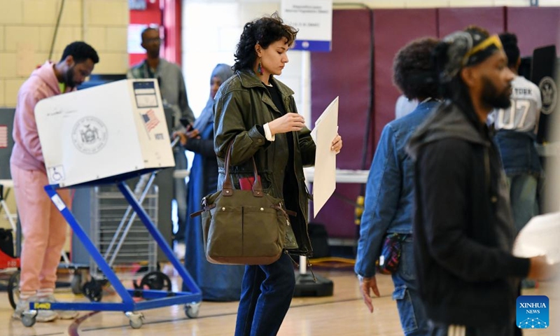 A voter prepares to cast her ballot at a polling station during the 2024 U.S. presidential election in Manhattan, New York City, the United States, on Nov. 5, 2024. (Photo: Xinhua)