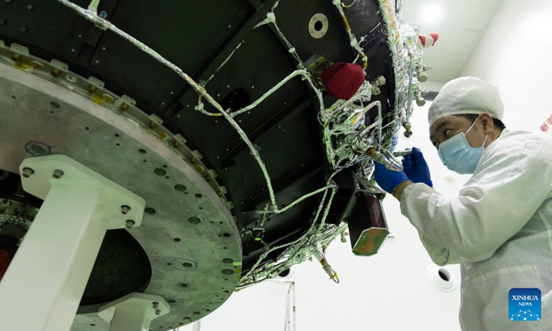 A technician checks the Solar wind Magnetosphere Ionosphere Link Explorer (SMILE) at a workshop of the Innovation Academy for Microsatellites of Chinese Academy of Sciences (CAS) in Shanghai, east China, Nov. 4, 2024. (Photo: Xinhua)