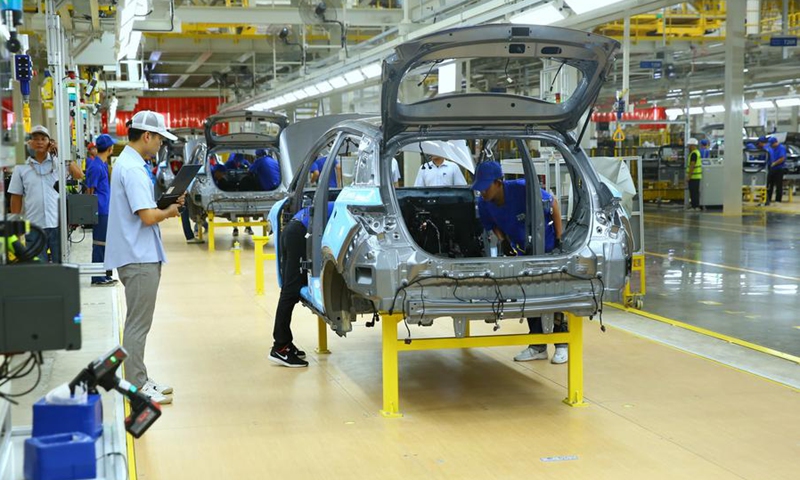 Workers operate at an assembly line of BYD's new plant in Rayong province, Thailand, July 4, 2024. (Xinhua/Sun Weitong)