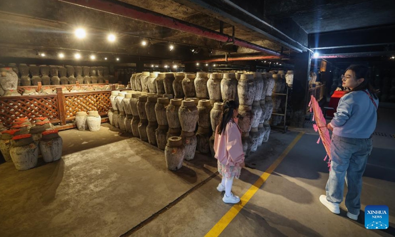 Tourists visit Shendang Winery Co., Ltd. in Haiyan County of Jiaxing City, east China's Zhejiang Province, Nov. 9, 2024. Shendang Winery Co., Ltd., a century-old winery in Shendang Ancient Town in Jiaxing, held a start-of-winter brewing ceremony for yellow rice wine on Saturday. The ceremony is a tradition observed around Lidong, or Start of Winter, the 19th of the 24 solar terms in the Chinese lunar calendar. (Xinhua/Xu Yu)