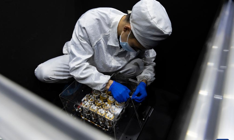 A technician packs the battery pack of the Solar wind Magnetosphere Ionosphere Link Explorer (SMILE) at a workshop of the Innovation Academy for Microsatellites of Chinese Academy of Sciences (CAS) in Shanghai, east China, Nov. 4, 2024. (Photo: Xinhua)