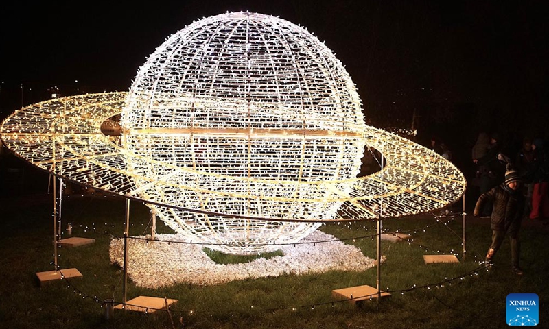 People visit a space-themed light exhibition in Prague, the Czech Republic, on Nov. 9, 2024. (Photo by Dana Kesnerova/Xinhua)