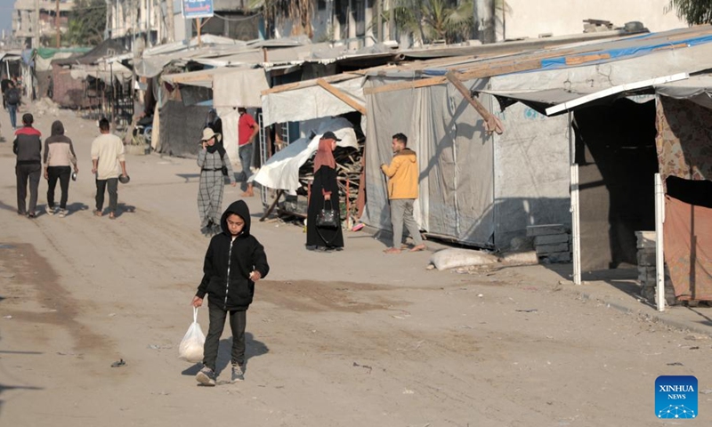 People are seen at an empty market in the southern Gaza Strip city of Khan Younis, on Nov. 5, 2024. (Photo: Xinhua)