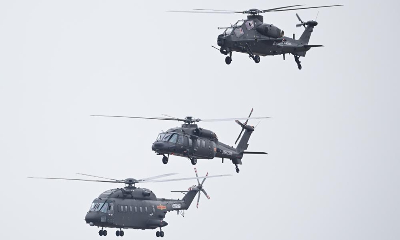 Z-10, Z-20, Z-8 (from top to bottom) helicopters conduct adaptive training for the upcoming Airshow China in Zhuhai, south China's Guangdong Province, Nov. 10, 2024. The 15th China International Aviation and Aerospace Exhibition, also known as Airshow China, will be held in Zhuhai from Nov. 12 to 17. (Xinhua/Deng Hua)