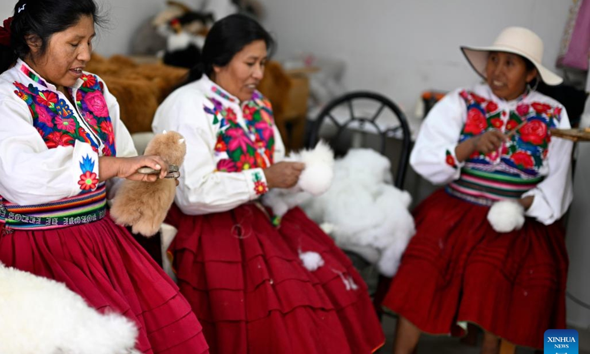 Workers make alpaca toys at the workshop of Peruvian craftsman Oswaldo Mamani in Arequipa, Peru, June 20, 2024.  (Photo: Xinhua)