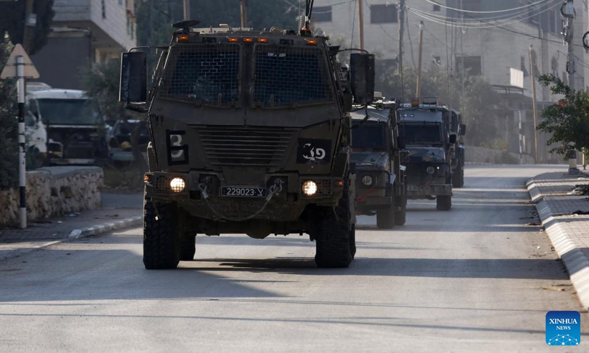 Israeli military vehicles are seen during an Israeli raid in Jenin, northern West Bank, on Nov. 5, 2024. Four Palestinians were killed in Israeli airstrikes and gunfire in Jenin and Tubas, the Palestinian Health Ministry said Tuesday.  (Photo: Xinhua)